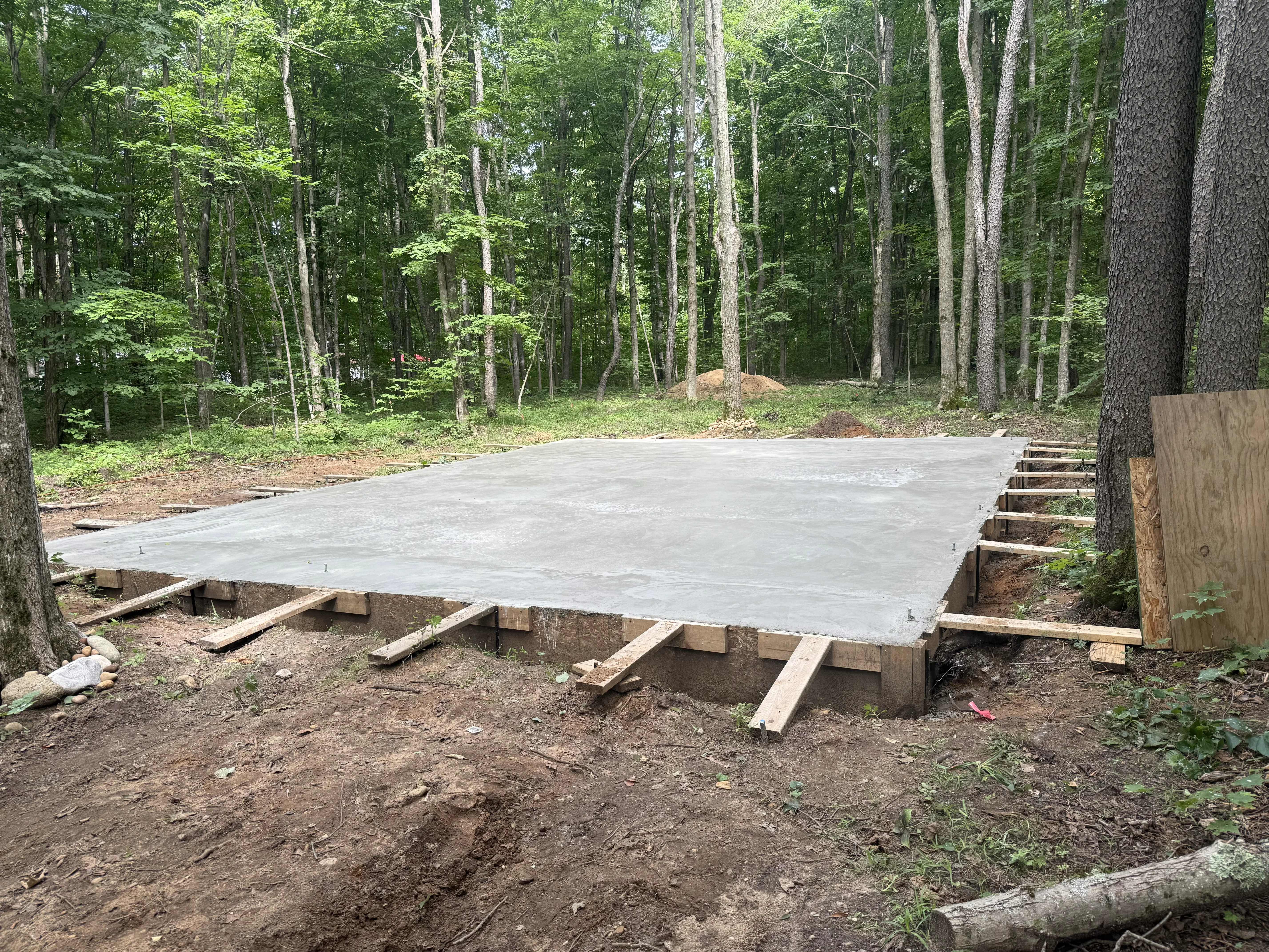 Freshly poured and finished concrete slab at a residential property in northern Michigan
